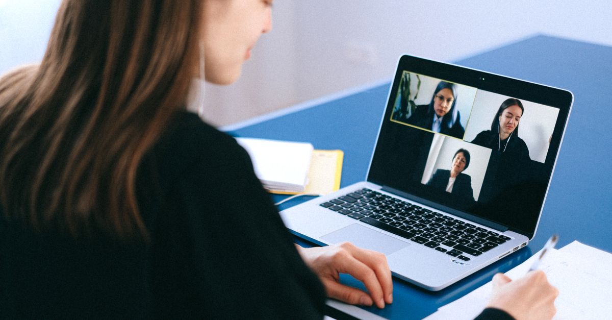 Person practicing a job interview on a laptop with an AI coaching interface