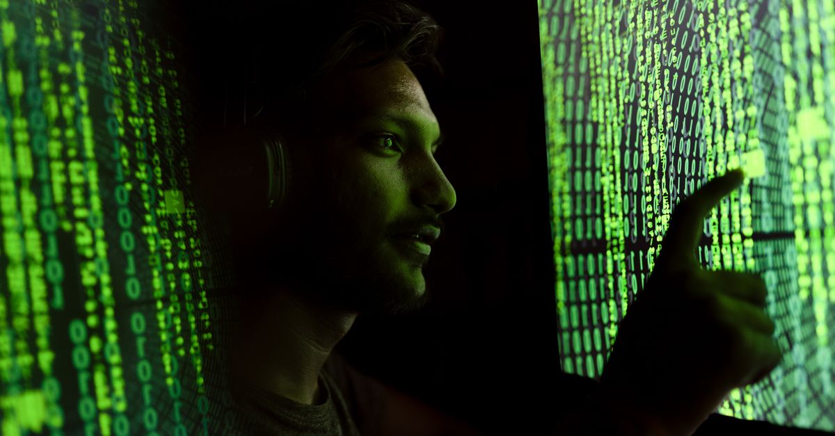 Close-up of a face on a screen with digital distortion suggesting a deepfake